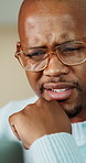 Thinking, black man and laptop for remote work, email or reading information online for proposal. Home, confused and African entrepreneur with computer for website info, doubt and project rejection