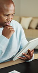 Reading, online and man with tablet in home office, freelancer and tax planning with research on web. Remote work, accountant or black person with financial report, happy and audit with tech in house