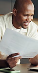 Man, smile and documents in home with laptop, financial planning or rebate for income tax preparation. Happy, black person and check paperwork in house with computer, budget or cost savings for bills