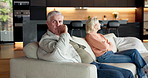 Elderly, couple and fight with separation on sofa for argument, divorce or conflict together in home. Senior, man and frustrated woman with stress for break up, toxic marriage or dispute in house