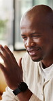 Annoyed, black man and fighting in home with conflict, disagreement and frustrated from argument. Thinking, male person or irritated at house for dispute, cheating accusation and communication issues