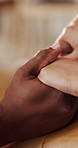 Holding hands, closeup and couple in home for support, love and bonding with compassion. House, love and people with embrace, gesture and affection for care, empathy and trust for relationship