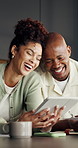 Tablet, happy and black couple in kitchen at house with funny meme on social media or online. Laugh, digital technology and African man with woman for reading comedy blog on app in apartment.