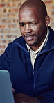 Architect, laptop and smile with black man on construction site for planning or research. Technology, feedback and review with building design on worksite for civil engineering or project management