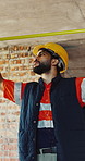 Measuring, man and construction worker on site for renovation, maintenance or building. Equipment, industry and male civil engineer with tape for property development with structure precision.