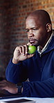 Architect, laptop and snack with black man on construction site for planning or research. Technology, feedback and apple with building design on worksite for civil engineering or project management