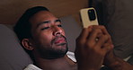 Night, insomnia or man with phone in bedroom for online browsing, network or addiction in home. Male person, scrolling or smartphone in bed for social media, internet or mobile connection in house