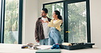 Couple, hug and ideas for home renovation, talking and planning for diy interior design in apartment. People, chat and brainstorming for decoration, property development and creative in new house