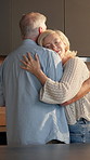 Morning, dance and senior couple in kitchen for bonding, relationship and connection in home. Marriage, happy and elderly man and woman with music, movement and embrace for affection, trust and love