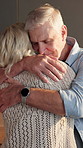 Hug, happy and senior couple in kitchen for bonding, relationship and connection in home. Marriage, smile and elderly man and woman with embrace for affection, support and love on weekend morning