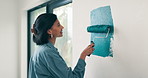 Happy, woman and painting with roller for home renovation, interior design and property upgrade. Creative, person smile and art tools in house with diy project, remodeling process and maintenance.