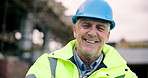 Face, engineer and happy man at construction site for development, building or confident with ppe. Smile, engineering or mature person with arms crossed, safety hard hat and infrastructure inspector