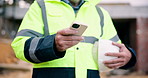 Research, phone and hands of construction worker on site with texting, communication or email. Technology, man and male civil engineer with cellphone for chatting with feedback on building approval.