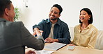 Broker, finance and handshake with couple in home together for budget, investment or wealth management. Deal, documents or speaking and happy people shaking hands with financial advisor in apartment