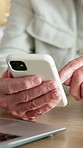 Senior, man and hands scroll with phone for browsing website, internet or retirement planning in home. Old person, typing and research in house with tech, connection or mobile app for life insurance.