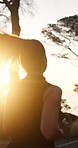 Fitness, sunset or woman outdoor with running, cardio or stamina exercise in physical activity. Training, back or female person in nature with jog, sports hobby or endurance workout in summer evening