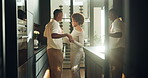 Holding hands, couple and dance in home for love, bonding or relationship connection with affection. African man,  woman and moving to music at kitchen, romance or spin partner for happiness together