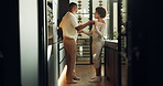 Holding hands, happy couple and dance in home for care, talking or relationship connection. African man, woman and moving to music at kitchen, romantic anniversary and hug partner for love with smile