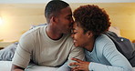 Love, black couple and kiss in bedroom with happiness, connection and loyalty together at home. Smile, man and woman in bed with romance for relax, trust and relationship security with partner