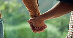 Couple, holding hands and bonding at park, love and connection with partner on break and commitment. People, care and affection for spouse in nature, together and loyalty for relationship or support