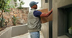 Knock, delivery man and front door with package for shipping, courier service and ecommerce order. Waiting, house and person with parcel, cargo and box for logistics, distribution and shipment