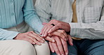 Holding hands, support and senior couple on sofa for love, commitment and bonding for relationship. Retirement, home and mature man with woman with understanding for comfort, marriage and connection