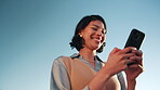 Phone, smile and typing with business woman outdoor for client contact, communication and realtor post. Online property feedback, happy and low angle of person for real estate with blue sky space