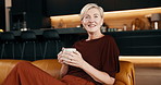 Face, coffee and mature woman in house with positive attitude, peace and relax on weekend break. Happy, female person and chill in living room with warm beverage, optimism and good mood for wellness.