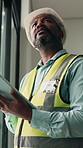 Construction, planning and tablet with black man on worksite for architecture or engineering. App, project management and thinking with mature person for building, maintenance or property development
