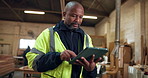 Ideas, black man and carpenter with tablet in workshop for research on furniture manufacturing. Digital technology, thinking and mature woodworker with planning for timber project in warehouse.