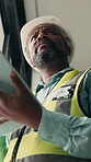 Building, tablet and thinking with black man on worksite for architecture or engineering. Below, construction and project management with mature person scrolling app for property development