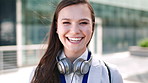 Face, woman and smile in city with realtor, headphones and commute for urban development. Happy, female person or real estate agent outdoor with portrait, confidence or travel for property management