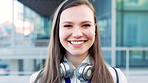 Face, woman and happy in city with realtor, headphones and commute for outdoor development. Smile, person or real estate agent with pride for portrait, confidence or travel for property management