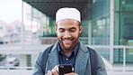 Happy, city and muslim man with phone for social media, communication or islamic app. Islam, male person or smile with mobile smartphone or fez for information, religion or network in an urban town