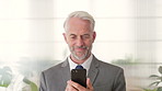 Phone, smile and mature businessman in office for financial notification, email or review earnings. Mobile, scroll and person in company for corporate info, investment app or CEO with budget approval