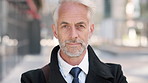 Face, businessman and serious in city with commute, attorney or pride for legal aid career development. Bokeh, mature person or lawyer in urban town with experience, confidence or travel to law firm.