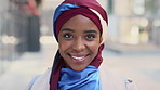 Black woman, happy and face with hijab in city for business trip, pride and travel for real estate job. Muslim person, smile and African realtor with headscarf, portrait or property career in Nigeria