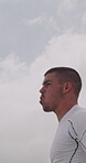 Athlete, man and throwing ball for soccer, goal protection and stop shot for competition. Male person, clapping hands and goalkeeper for defensive play, football tactical and game day for tournament