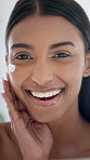 Happy, woman and face with lotion for skincare, morning routine or moisturizer in bathroom. Portrait, female person or smile with cream, beauty cosmetics or dermatology for anti aging skin in home