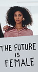 Face, women and empowerment in office with sign, solidarity or group affirmation for creative business. Serious, female people and feminist poster at workplace for equality, revolution and inclusion.