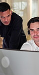 Telemarketing, men and team in office with computer, advice or planning for lead generation at night. Late, bokeh and people talk in call center with desktop, online research or tips from sales agent