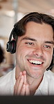 Telemarketing, man and talk in office with computer, advice or consulting for lead generation at night. Late, coworking and person in workplace with desktop, conversation and outbound call for sales.