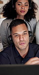 Telemarketing, man and team in meeting with computer, advice or planning for lead generation at night. Late, bokeh and people talk in call center with desktop, collaboration or tips from sales agent.