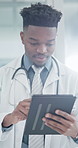 Scrolling, black man and doctor with tablet in hospital with research for medical diagnosis or treatment. Digital technology, telehealth and healthcare worker with online patient record in clinic.
