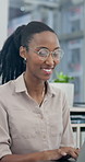 Laptop, laughing and typing with business woman in office for planning, research or review. Computer, funny and glasses with happy employee in workplace for agenda, email feedback or schedule