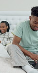 Couple, man and typing in bed with laptop, check email and company communication for remote work. Black people, dating and computer in home with freelance job, research or browse internet in morning.