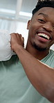 Black man, bed and pillow fight in playful morning, wake up or bonding together in home. Happy man, POV and smile for weekend, holiday or break with cushion game and humor or excited in bedroom