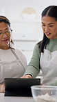 Baking, senior mother and women with tablet, laughing and searching for recipe on website in kitchen. Online, mature person and talking to daughter with tech, happy and learn culinary skills in house