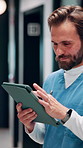 Reading, nurse and man with tablet in hospital, medical journal or email for healthcare publication. Review, smile or person with newsletter for clinical treatment policy, tech or typing for research