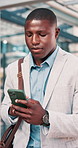 Businessman, walk and commute in city with phone, check text message and online company communication. Black person, journey and typing in urban town with tech, email notification and travel to work.
